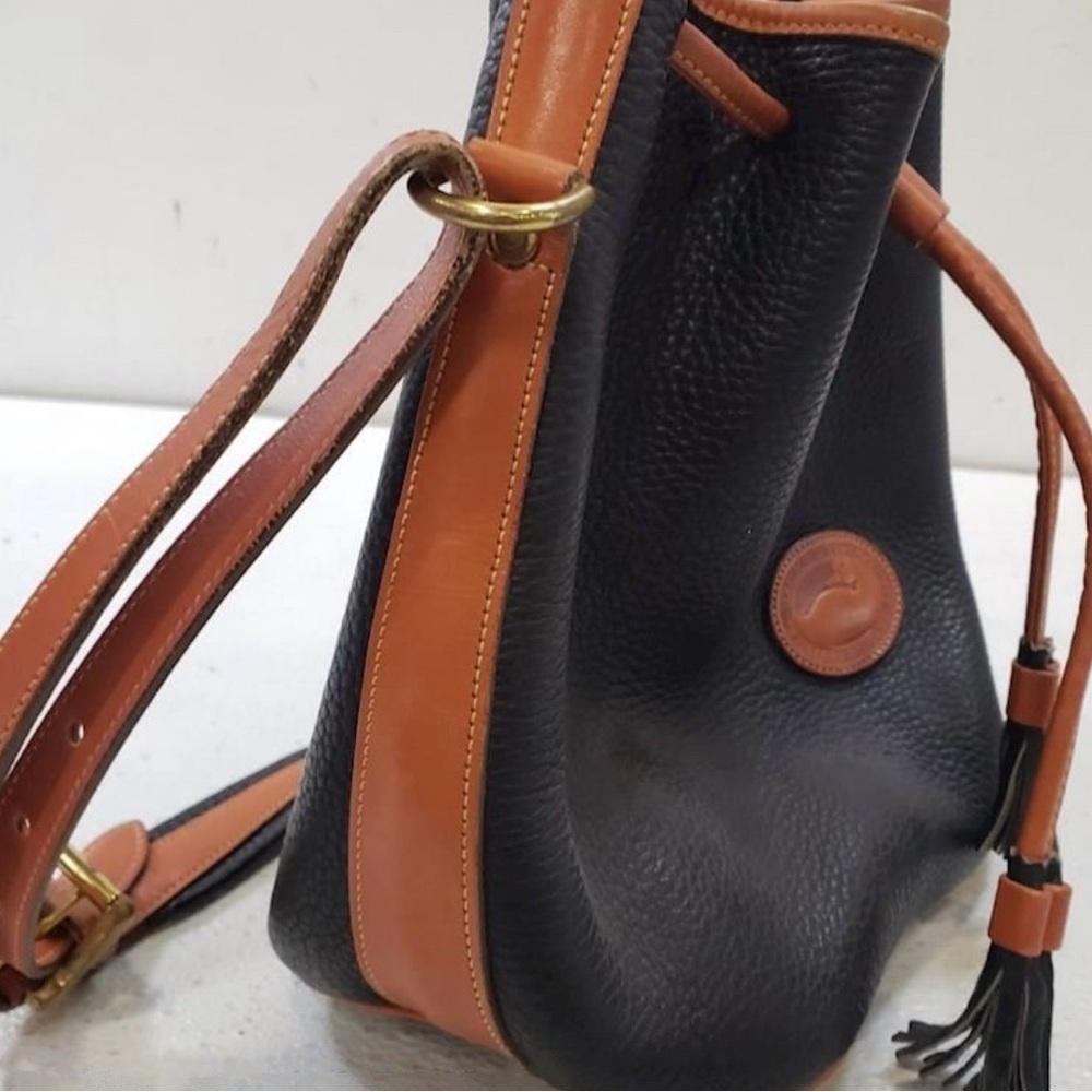 New Dooney & Burke Pebble Grain Leather
Drawstring Crossbody Bucket Bag. - Picture 12 of 16